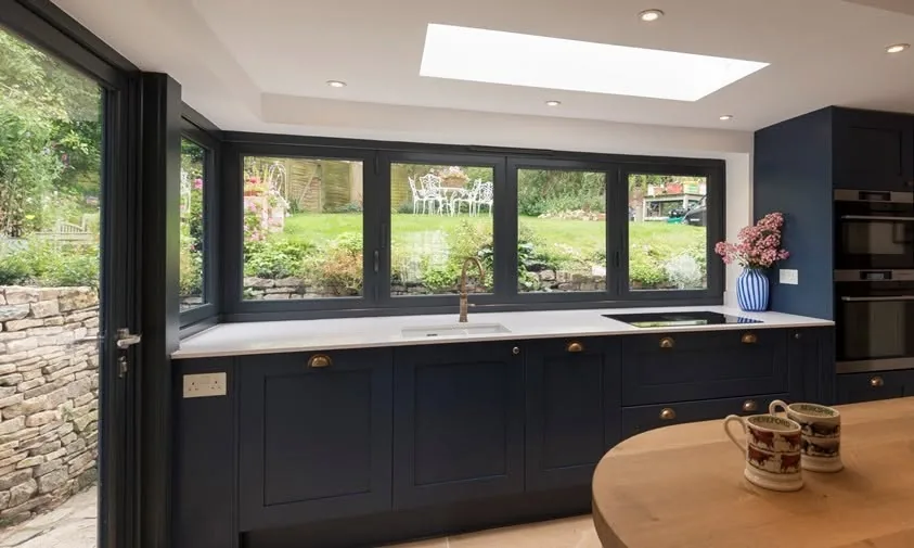 Luxury kitchen run with a full width window band over the worktop