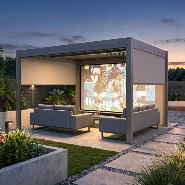 Louvred pergola with drop screens lit at dusk