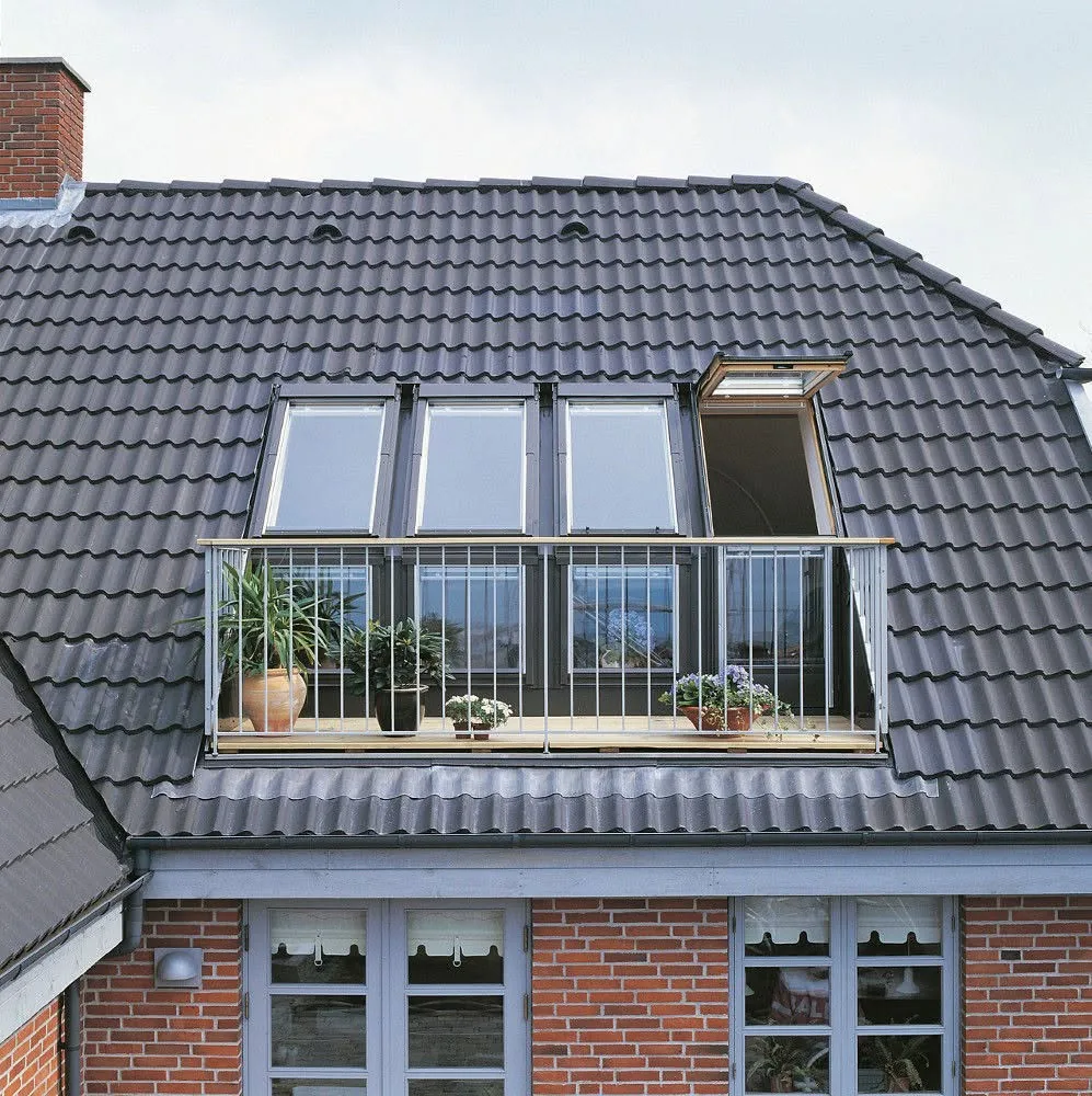 Roof windows opening out to form a balcony